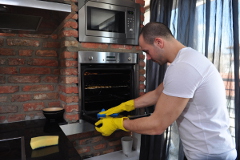 Oven Technician Cleaning an Oven